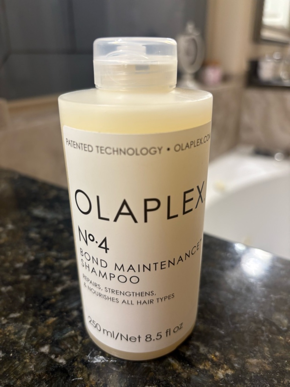 OLAPLEX No.4 Bond Maintenance Shampoo - Cream White Bottle with Black Logo